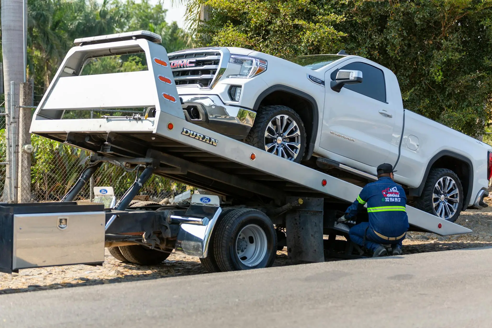 A tow truck dispatcher in a local office coordinating a rapid response for a stranded driver in Brentwood.